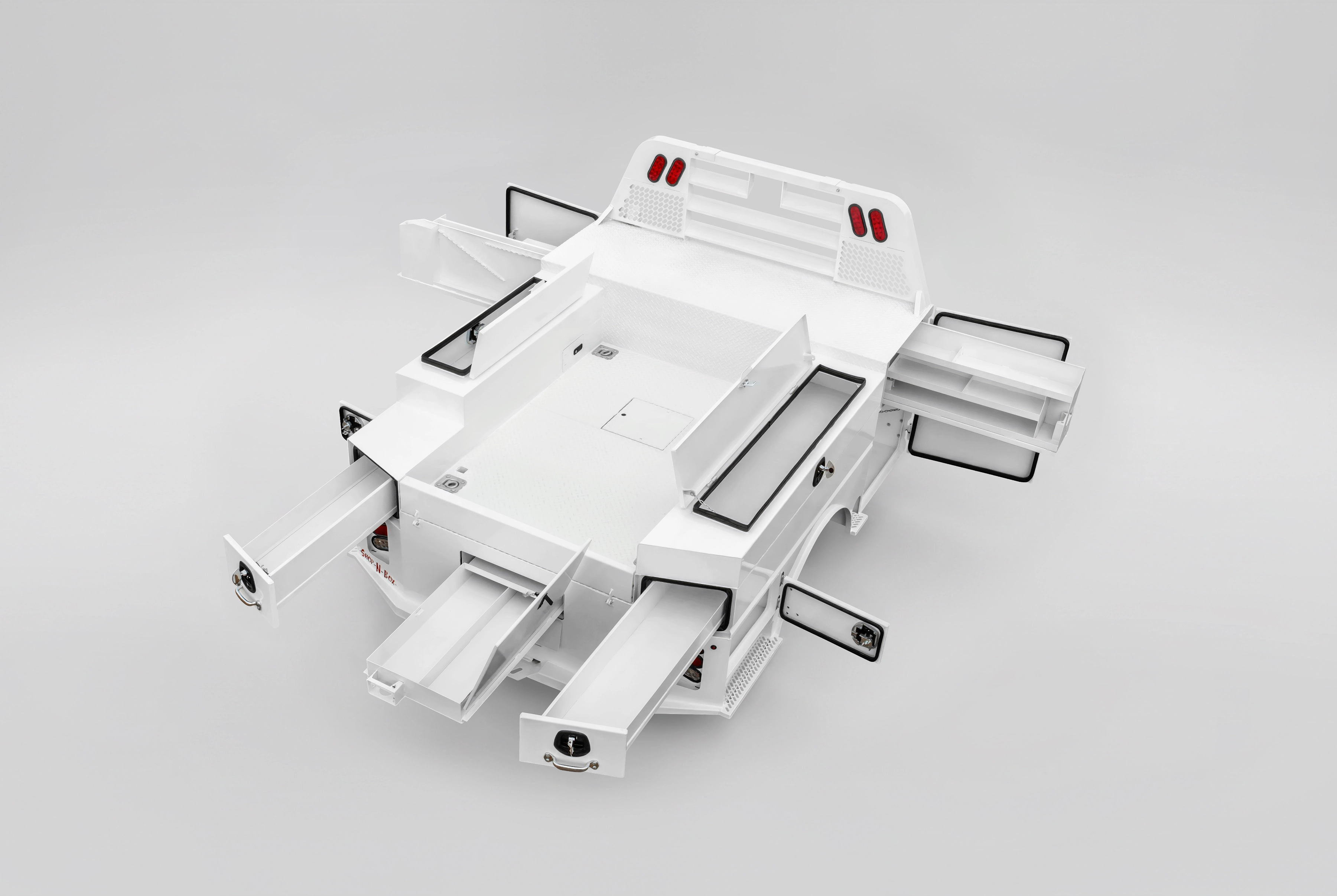 Shop-N-Box truck bed toolbox system with multiple drawers open