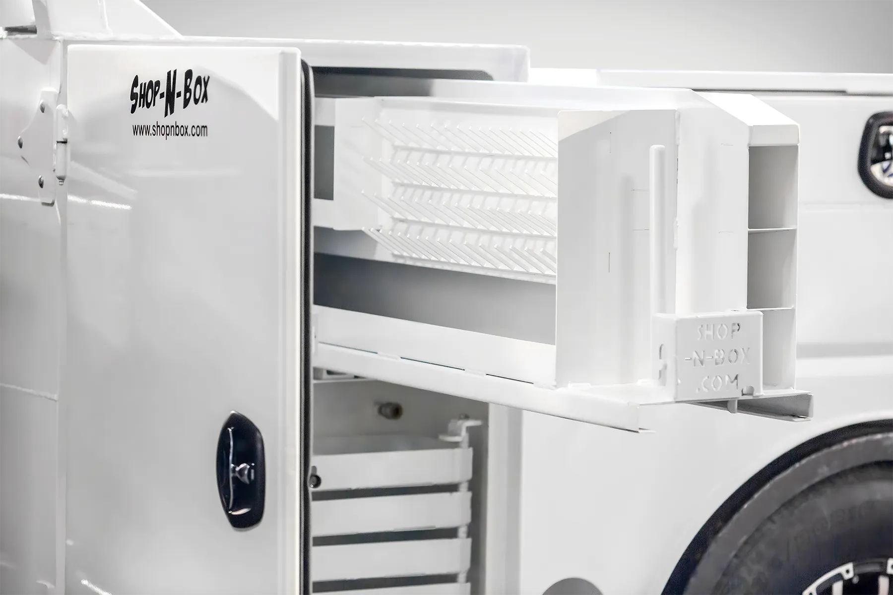 Shop-N-Box™ truck bed drawer system extended showing patented roller system and internal tool organization