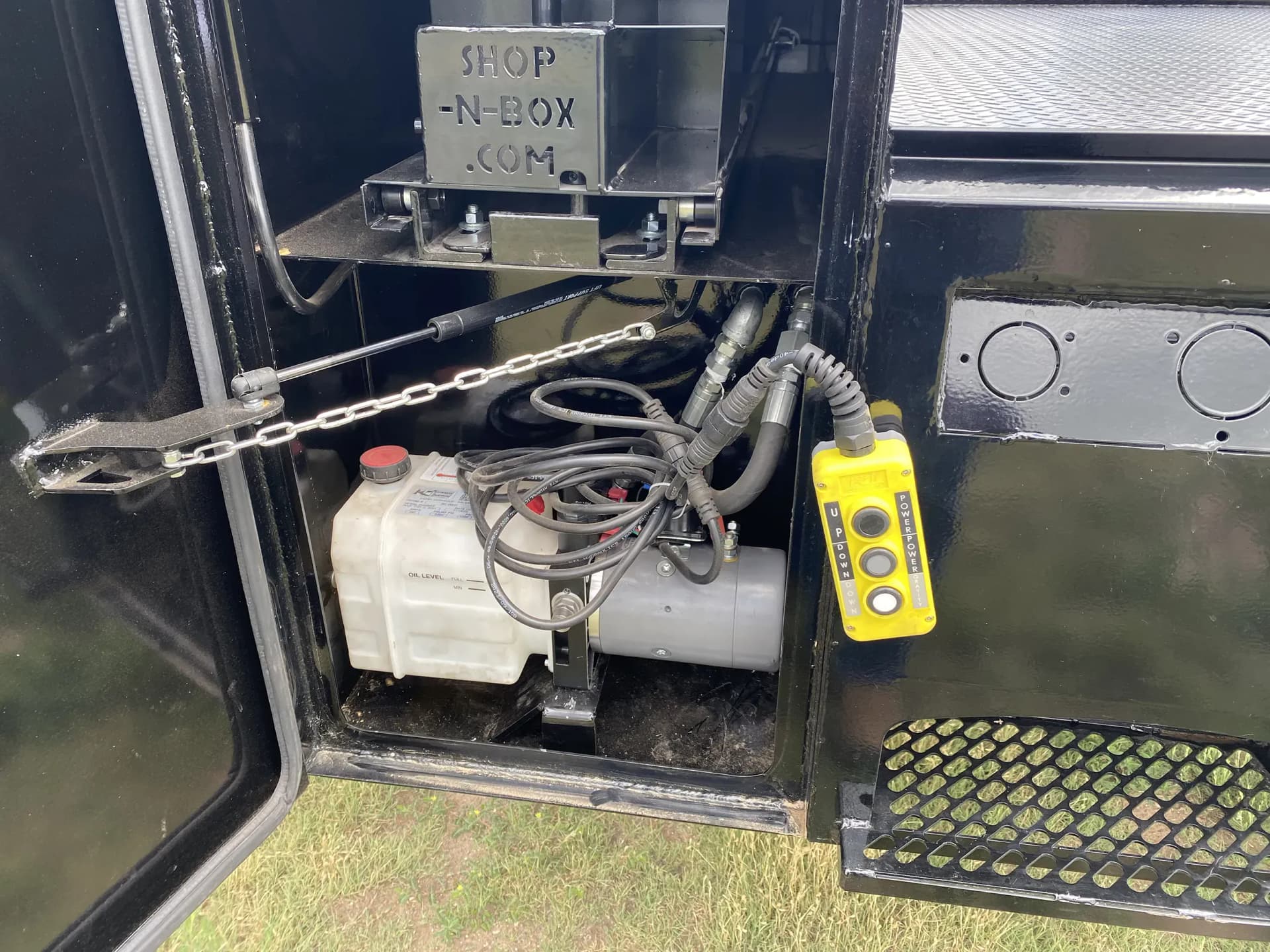 Shop-N-Box™ Hay Spike bed flatbed with hay bale spikes and integrated roll-out tool storage