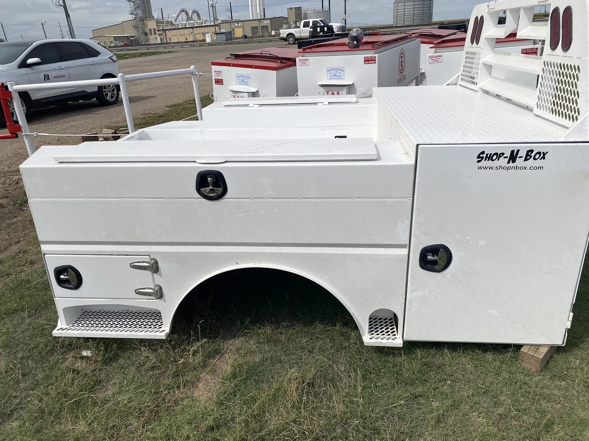 Shop-N-Box Legend Bed white finish side view showing modular inserts and rear roll-outs