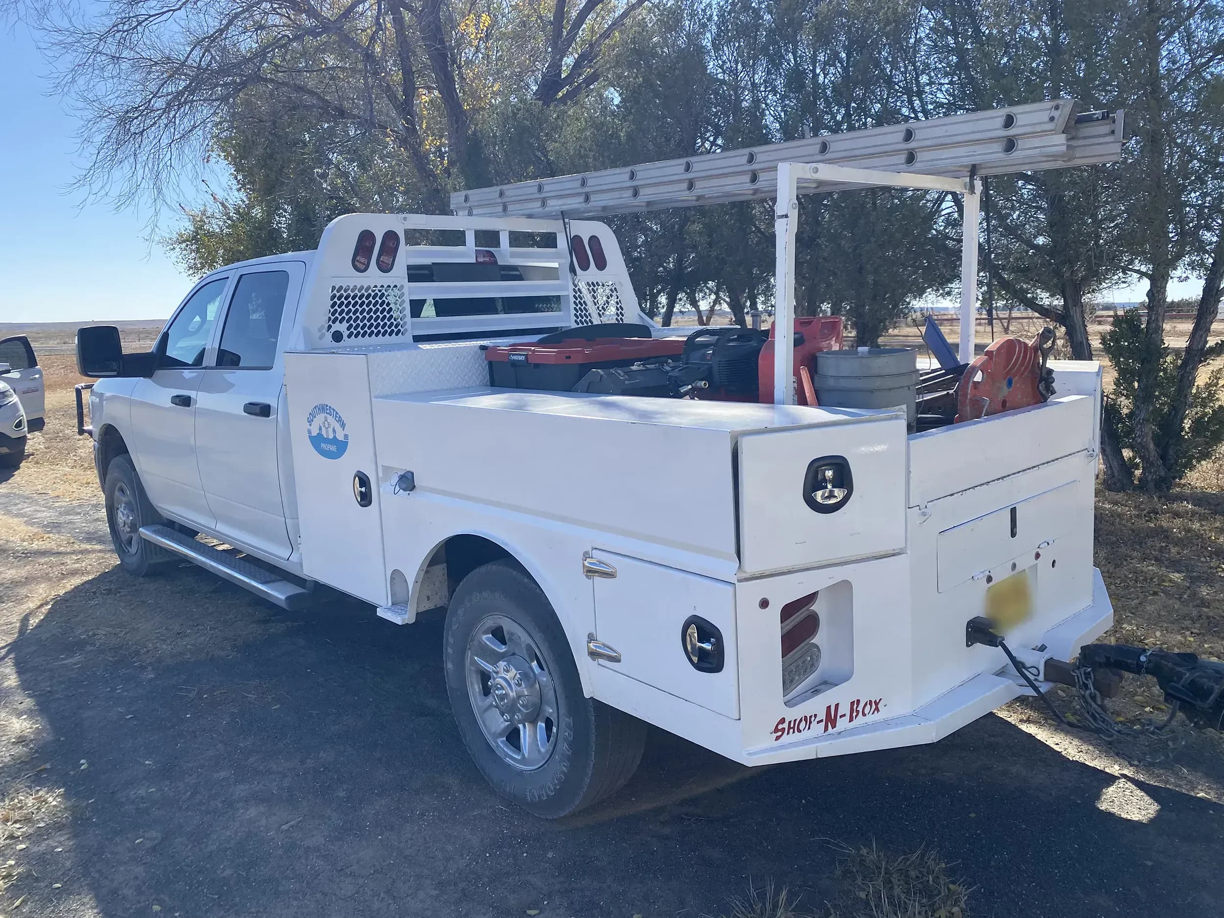 Legend Bed on white truck with ladder rack