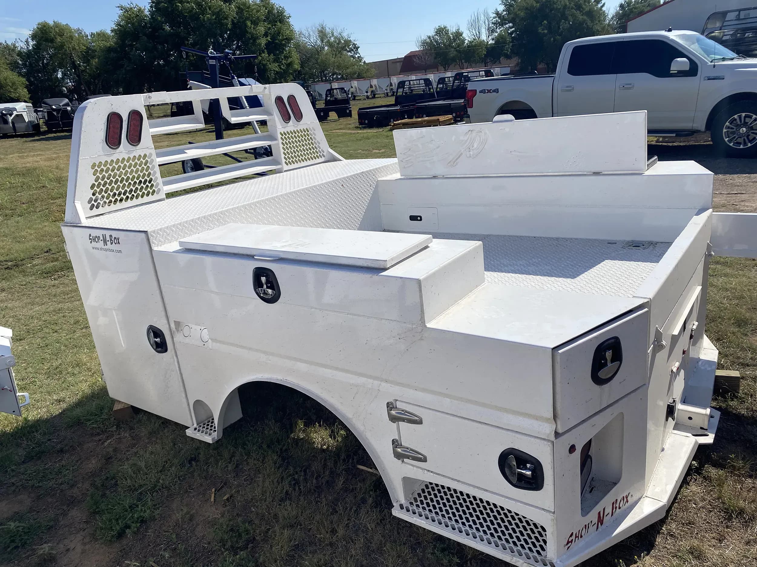 Shop-N-Box Legend Bed white finish outdoor showing positive air ventilation system