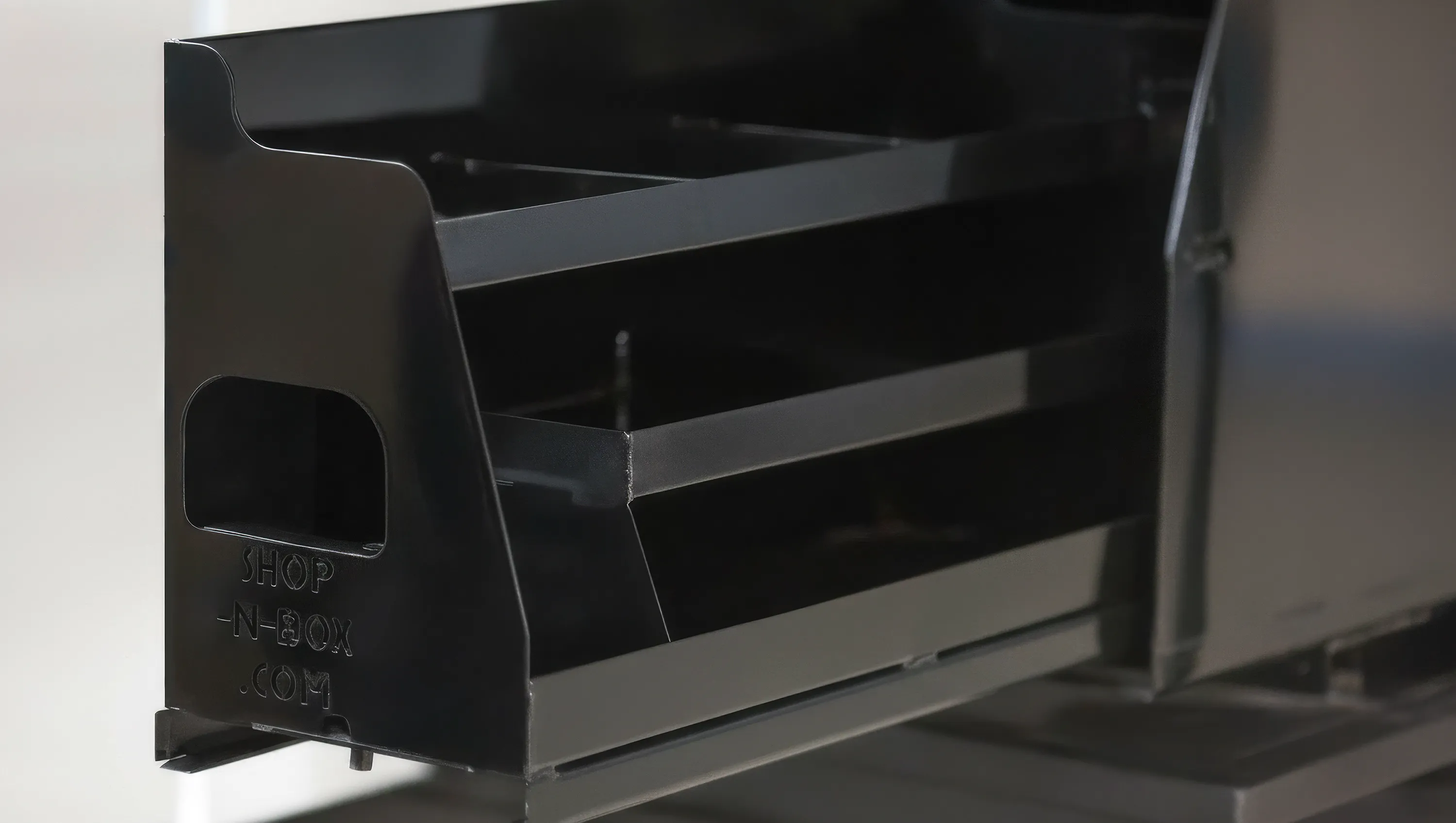 Shop-N-Box™ Legend Bed patented roller system mechanism showing heavy-duty rollers on steel floor