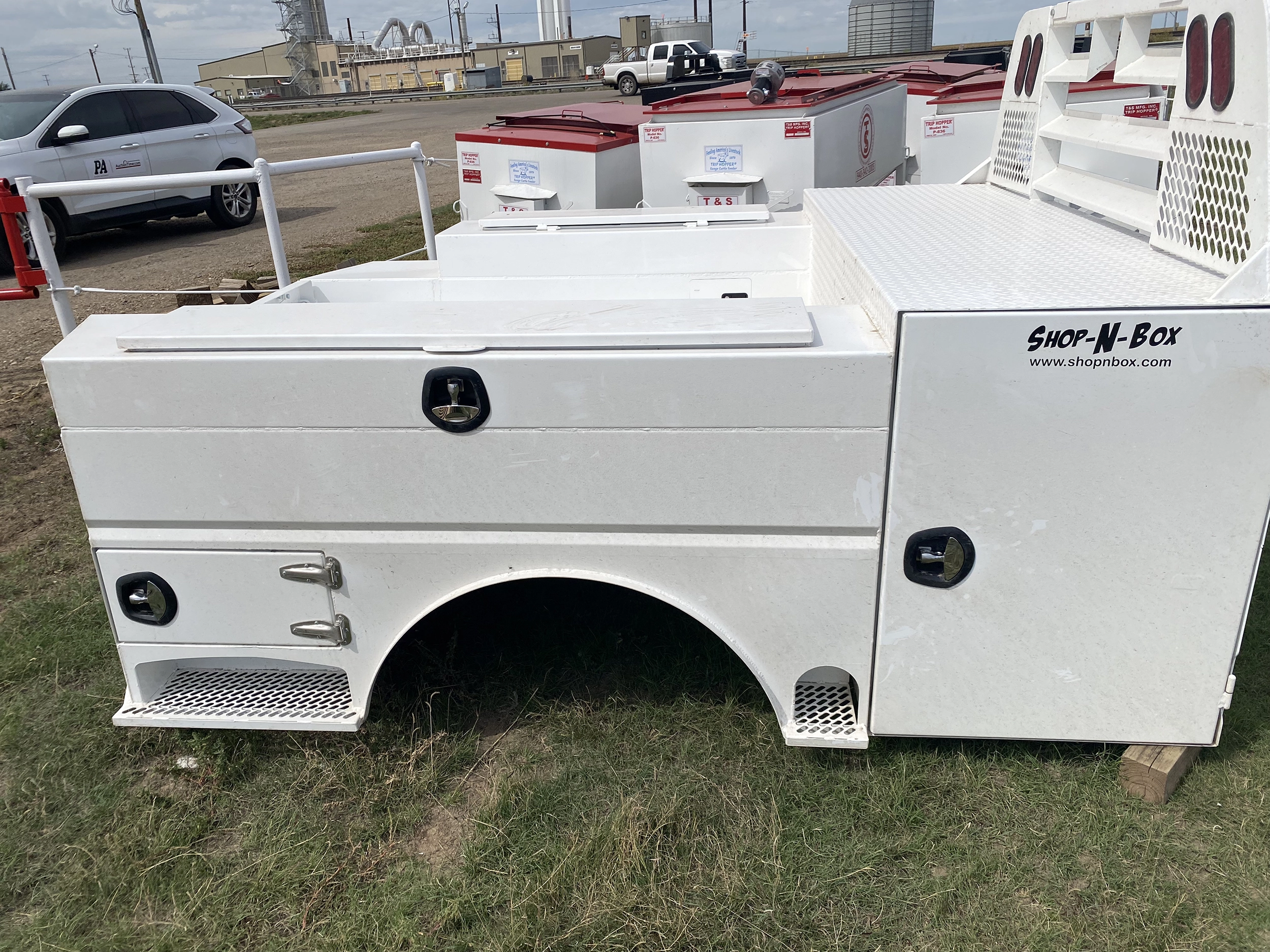 Shop-N-Box Legend Bed white finish side view showing modular inserts and rear roll-outs